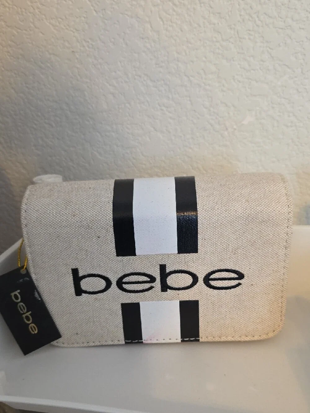 bebe Cream and Black Striped Cosmetic Case
